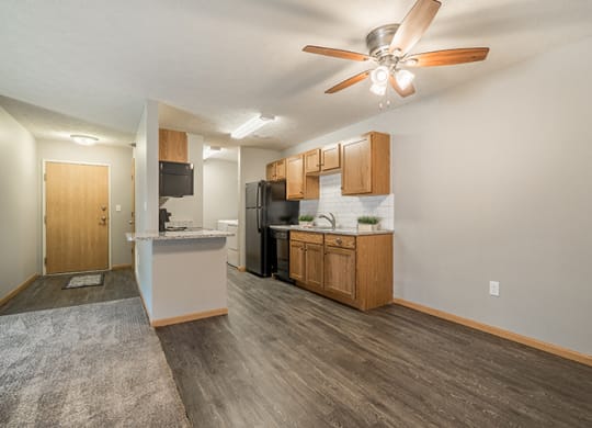 Kitchen with hardwood-style flooring at Williamsburg Park Apartments in Lincoln NE