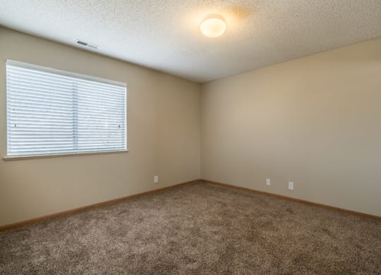 Large bedroom with bright lighting at Skyline View Apartments in Lincoln NE