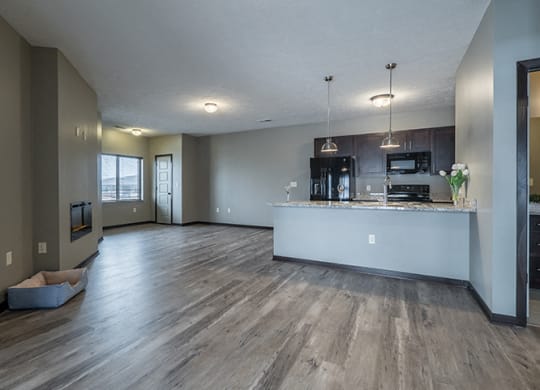 view of open floorplan living space and kitchen including island at North Pointe Villas