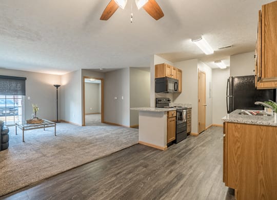Kitchen with hardwood-style flooring at Williamsburg Park Apartments in Lincoln NE
