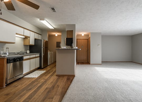 View of open floorplan showing kitchen and living room at Eagle Run Apartments