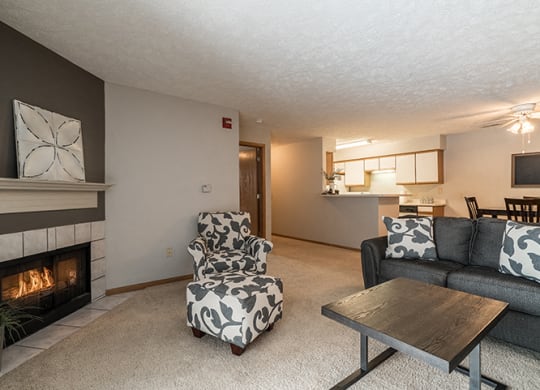Large spacious living room with fireplace at Eagle Run Apartments
