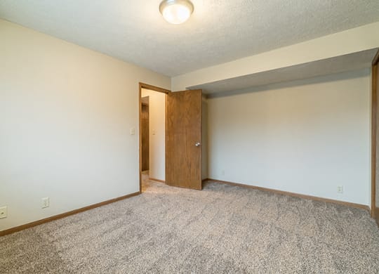 Bedroom with plenty of natural light at Fountain Glen Apartments