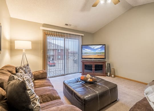 Living space with sliding doors at Fountain Glen Apartments