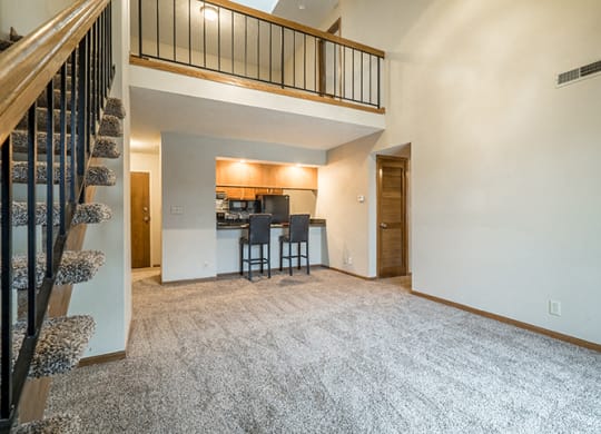 Open concept loft floorplan with view off living room and loft at Fountain Glen Apartments
