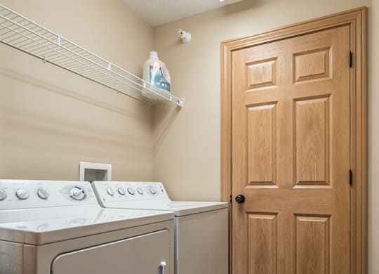 Full sized washer and dryer available in unit at Grand Legacy Apartments