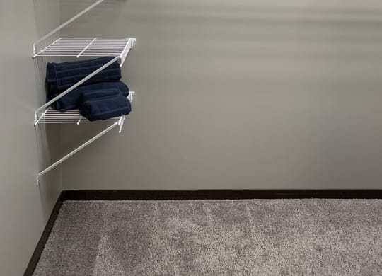 Large walk in closet with shelves for clothing storage in a 3 bedroom villa