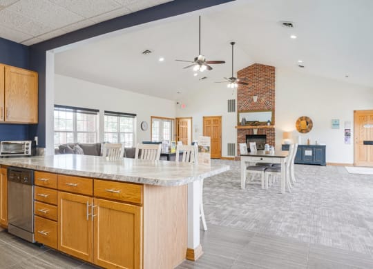 the view from the community kitchen into the living room and dining room of the clubhouse at Williamsburg Park