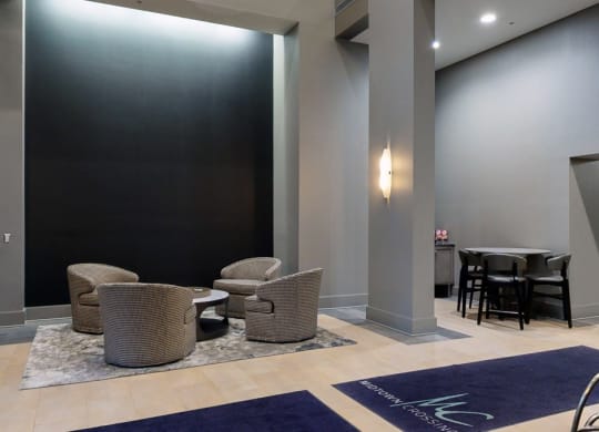 Grab a book and relax in the modern lobby at Midtown Crossing Apartments in Omaha.
