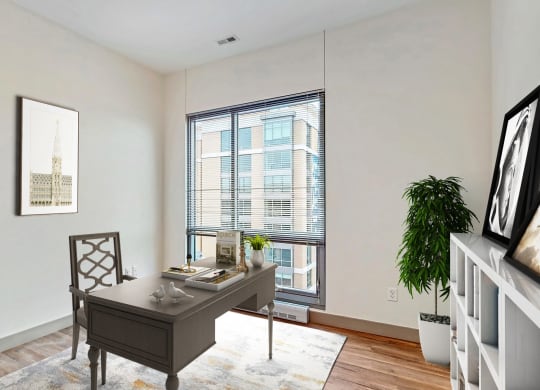 Bright and spacious bedroom that could be used as home office with floor-to-ceiling windows a 2 bedroom penthouse floor plan Midtown Crossing Apartments Omaha