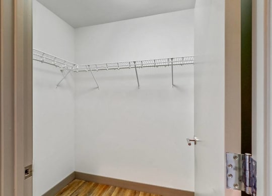 Easy living with plenty of storage space in the walk in closet of a 2 bedroom penthouse floor plan at Midtown Crossing Apartments Omaha