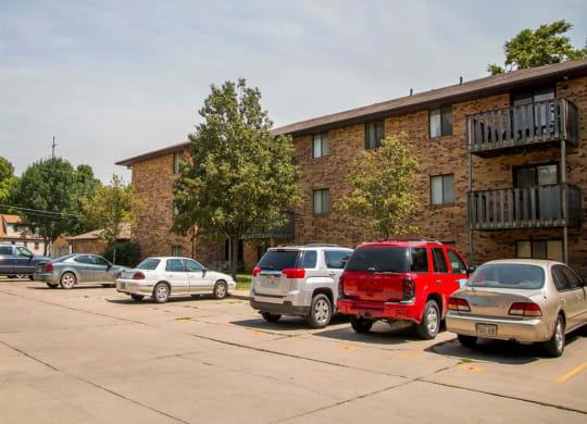 exterior side with parking lot at Moore Place Apartments in Lincoln Nebraska