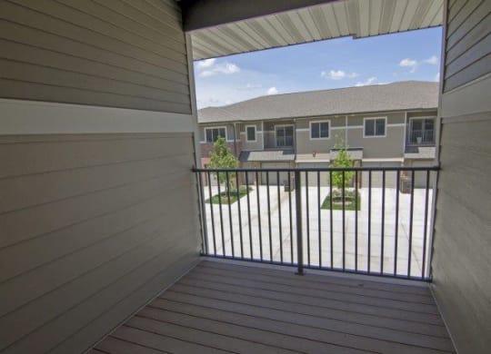 Empty balcony overlooking another villa building