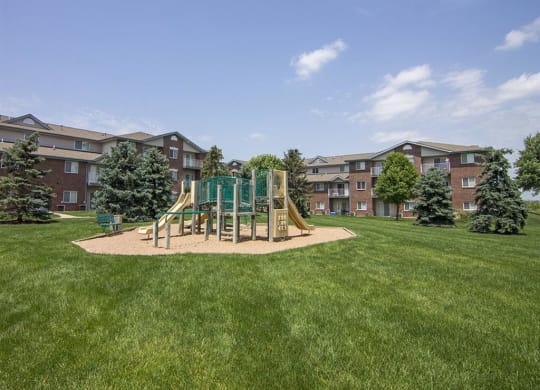 Playground and grass at Northridge Heights apartments in Lincoln