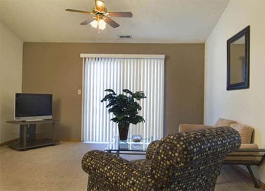 amazing living space with large sliding doors that provide plenty of natural lighting at Packard House Apartments in Lincoln Nebraska