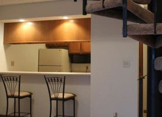 kitchen bar seating and stair case at Packard House Apartments in Lincoln Nebraska