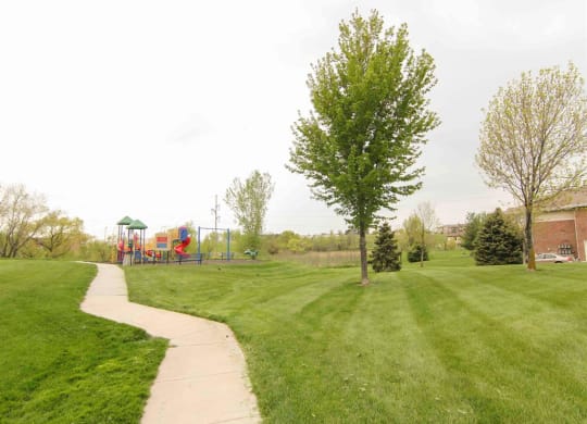 Walking trails and playground at the Northbrook Apartment Homes in Lincoln NE