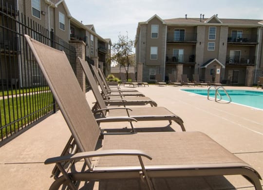 Swimming pool and lounge chairs at Eagle Run Apartments in Omaha NE