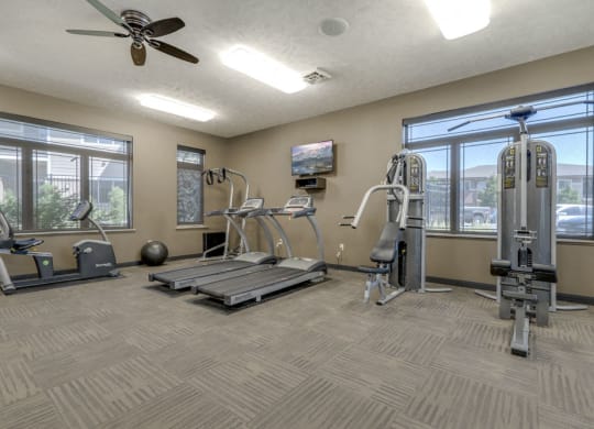Fitness center with strength and cardio equipment at North Pointe Villas