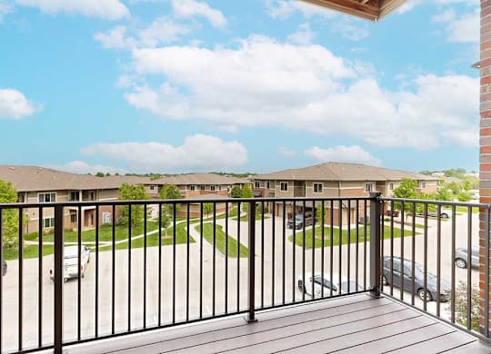 A view from the balcony overlooking the community and blue sky.