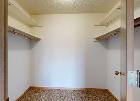 large walk in closet with shelving