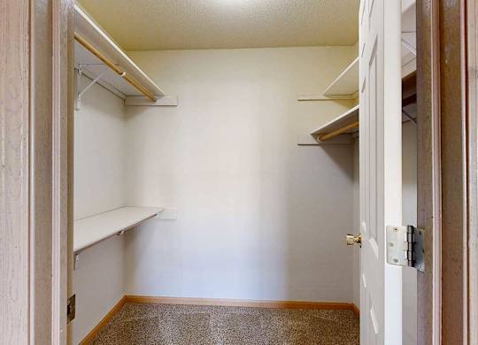 large walk-in closets with a shelving and storage