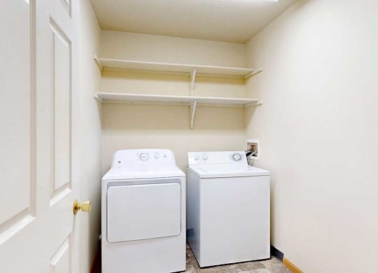 washing machine and dryer in a laundry room