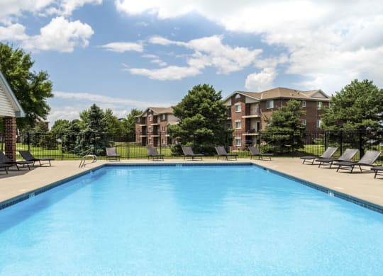 Pool with lounge chairs at Northridge Heights Apartments!