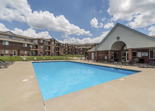 Pool with lounge chairs at Northridge Heights Apartments!