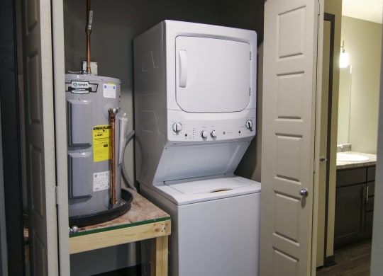 Stacked washer and dryer off bathroom at Northridge Heights in Lincoln