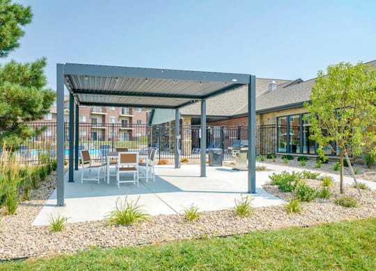 Covered outdoor seating and dining area with modern furniture