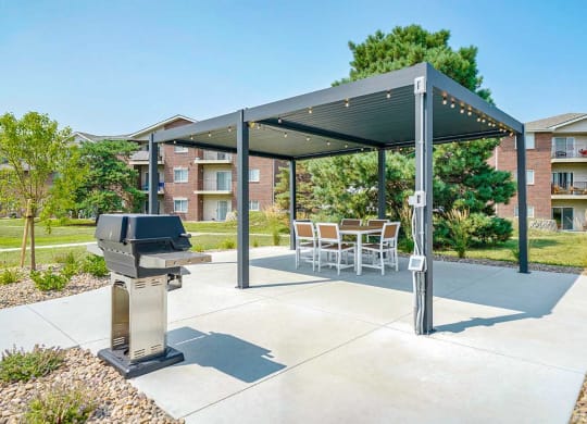 Covered patio with tables and seating near the pool