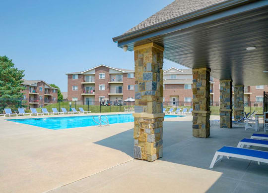 Spacious outdoor swimming pool with lounge chairs