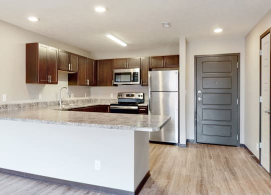 Renovated kitchen with large peninsula island with ample storage at Northridge Heights