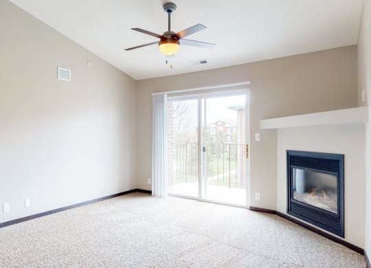 Renovated living room with high ceilings and gas fireplace at Northridge Heights in Lincoln