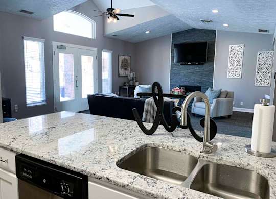 a kitchen with a sink and a counter top