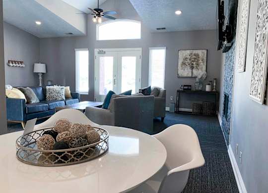 apartment clubhouse with a white table and chairs