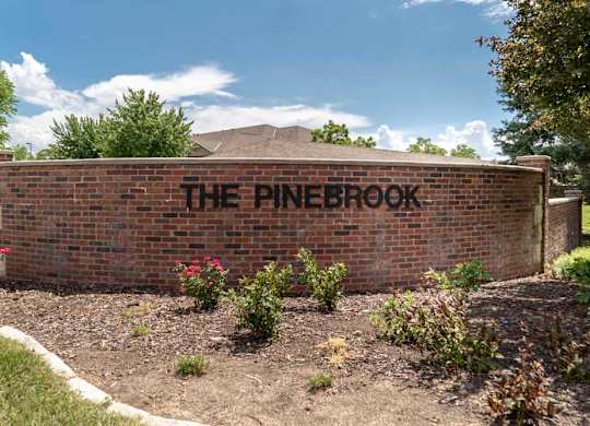 A brick wall with the words
