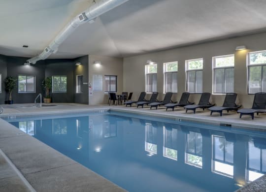 Indoor Saltwater Swimming Pool with lounge seating at Cascade Pines Duplex Homes in Lincoln NE