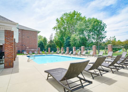 Swimming pool with lounge chairs for sunbathing