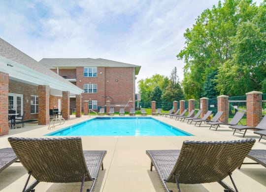 Swimming pool with lounge chairs for sunbathing