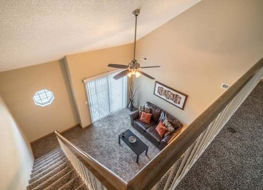 View from top loft of apartment into the living room below