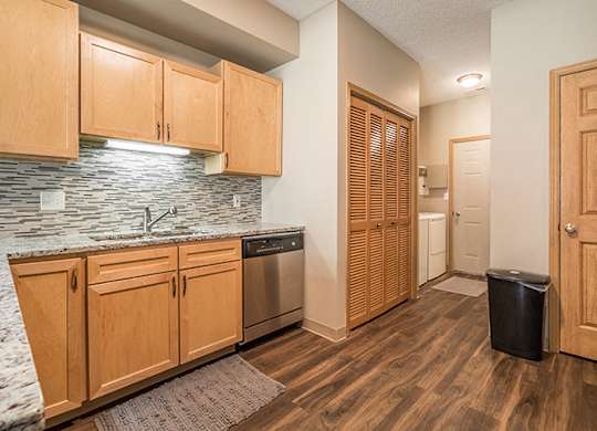 Upgraded unit with stainless-steel appliances and kitchen backsplash at Southwind Villas in La Vista, NE
