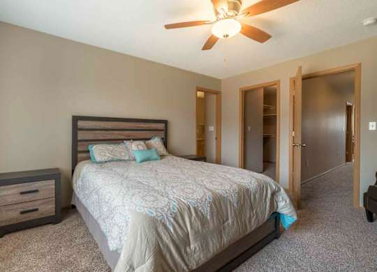 Master bedroom with walk-in closet and master bath at Southwind Villas in southwest Omaha in La Vista, NE, 68128