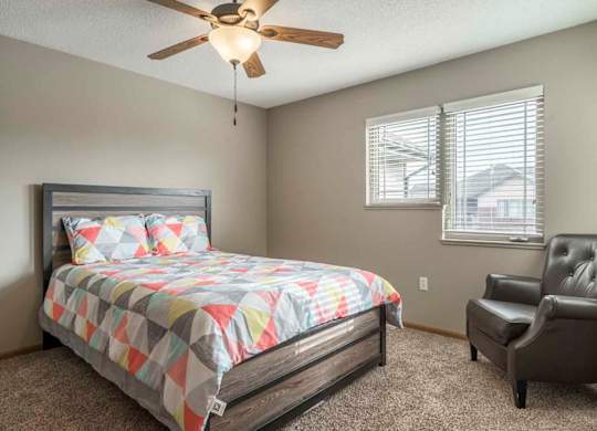 Second bedroom with ceiling fan at Southwind Villas in southwest Omaha in La Vista, NE, 68128