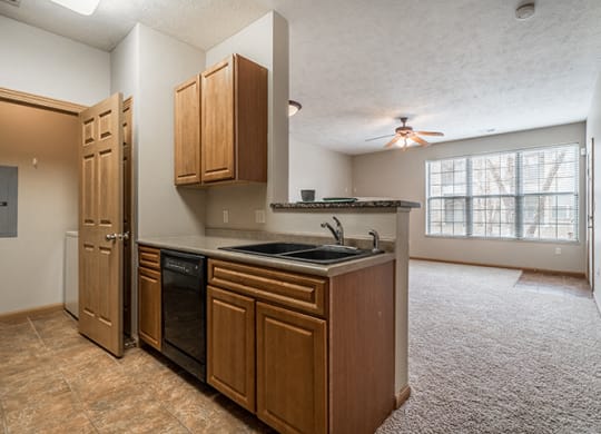 Kitchen with Washer and Dryer in closet at Stone Creek Villas Apartments in Omaha Nebraska