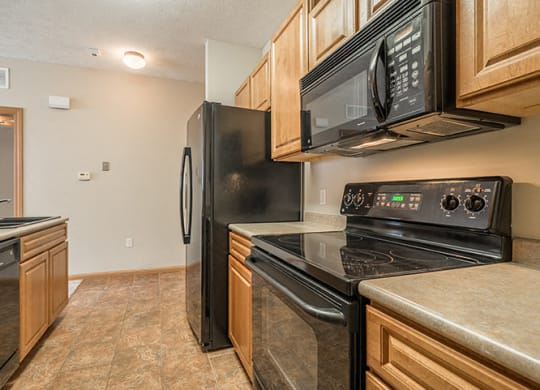 Kitchen with flat-top stove at Stone Creek Villas Apartments in Omaha Nebraska