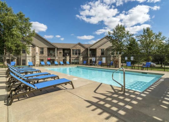 Swimming pool with lounge chairs at Stone Creek Villas townhomes in west Omaha NE 68116