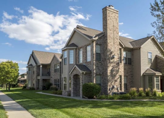 Exterior view of private entrances and large windows at Stone Creek Villas townhomes in west Omaha NE 68116