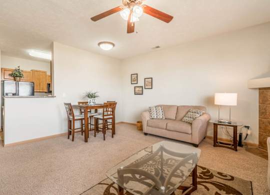 a living room and dining room with a couch and a table